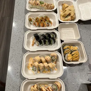 a variety of food in styrofoam containers