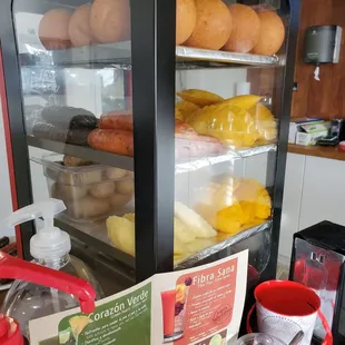The hot case of fried cheese bread balls, sausages (including morcilla), empanadas, and more