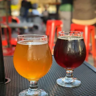 two glasses of beer on a table