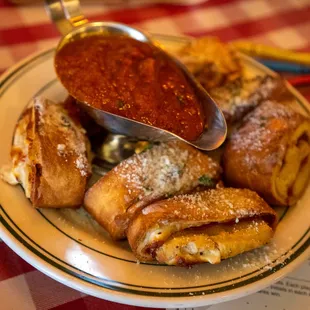  plate of pastries with sauce