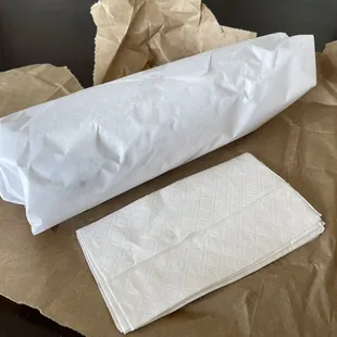 a roll of paper and a napkin