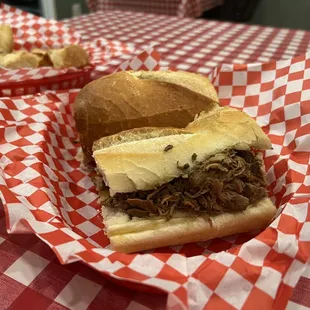 a pulled pork sandwich in a basket