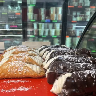 REGULAR CANNOLI (LEFT SIDE) CHOCOLATE CANNOLI (RIGHT SIDE)
