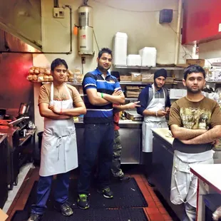 a group of men in a kitchen