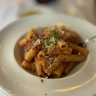 a plate of pasta with parmesan cheese