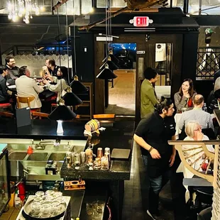 a group of people eating in a restaurant