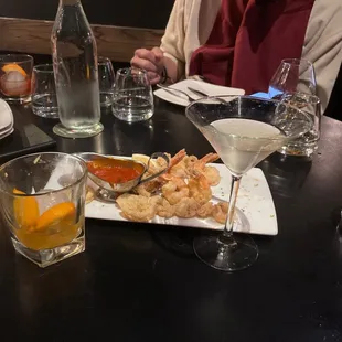 Delicious shrimp, calamari, smoked old fashioned &amp; dirty martini.