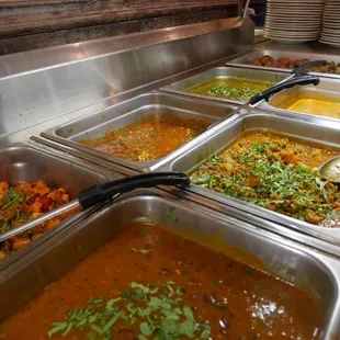 a variety of food in a buffet