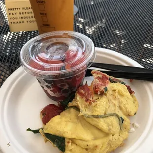 Omelette Florentine with fresh fruit and mango smoothie.