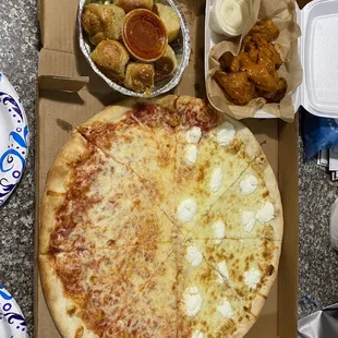Half cheese half Bianca pizza mild wings and of course garlic knots