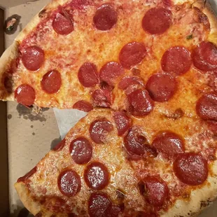 two slices of pepperoni pizza
