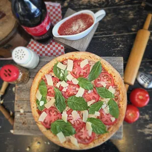 Margarita Pizza Fresh basil, ripe tomatoes, and a blend of parmesan and mozzarella. Simple, fresh, and flavorful!
