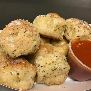 a plate of cheese and tomato sauce