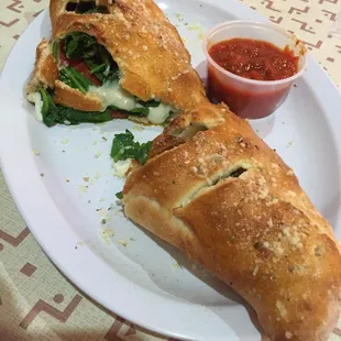 Calzone with pepperoni and spinach