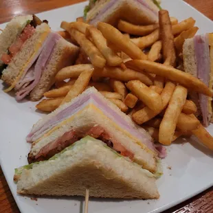 a club sandwich and fries