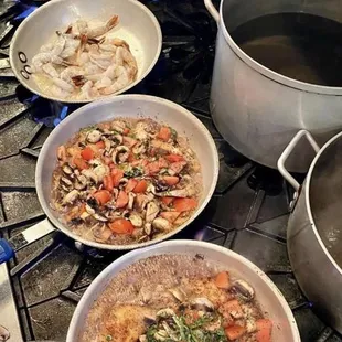 a variety of dishes on a stove