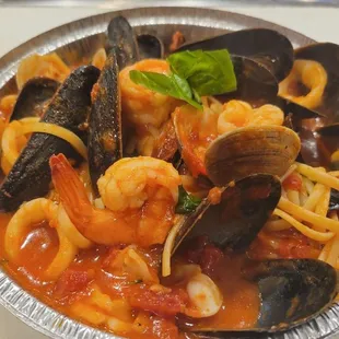a bowl of seafood and pasta