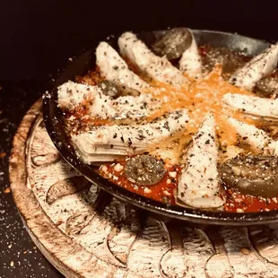 a pizza with cheese and peppers