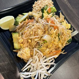 a plate of noodles and vegetables
