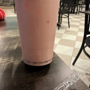 a smoothie in a plastic cup