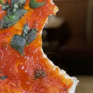 A piece of hair in a Margherita pizza