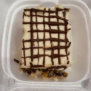 a piece of cake in a styrofoam container
