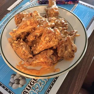 a plate of chicken wings on a table