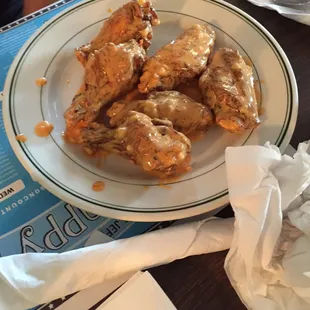 a plate of chicken wings on a table