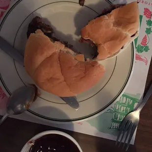 a half eaten sandwich on a plate