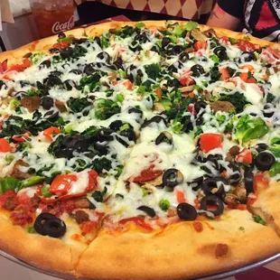 The Romano&apos;s Deluxe! Pep., hamburger, sausage, ham, bacon, spinach, broccoli, olives, tomatoes, green peppers, onion, and cheese. A must try