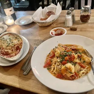 a plate of pasta and a bowl of sauce