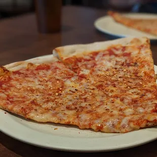 a slice of pizza on a plate