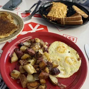Corned beef hash, pancake and cheesy hash browns.