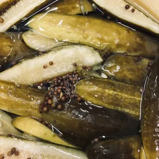 a close up of a bowl of pickles
