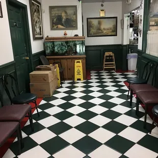 a checkered floor with chairs