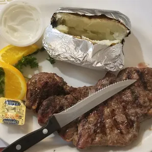 New York strip steak with a baked potato