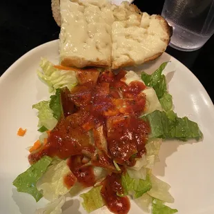 Salad with house dressing, cheesy garlic bread