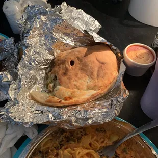 Sausage, pepperoni, and jalapeño calzone... along with Chicken  Milaneze...