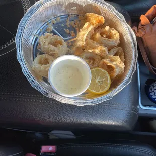 What&apos;s left of my fried calamari to go with ranch dressing. It comes with marinara sauce but we substituted ranch.