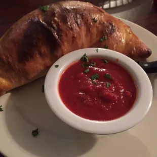 Calzone. Inside is meaty cheesy goodness.