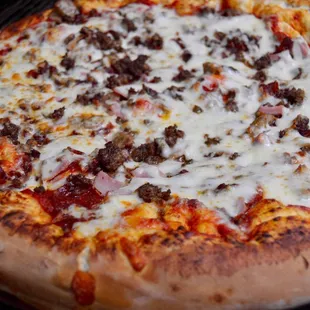a pizza on a grill