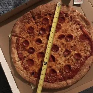 This is supposed to be an 18" pizza.  And 2" wide of crust on the pizza makes it even smaller.  So basically I got a 13" pizza