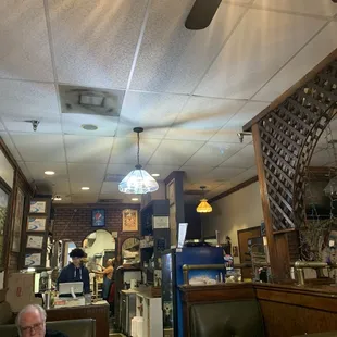 a man sitting at a table in a restaurant