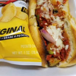 Meatball sub with added green peppers and onions. Came with chips on the side.