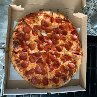 a pepperoni pizza in a box