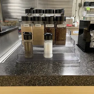 a counter with a variety of spices