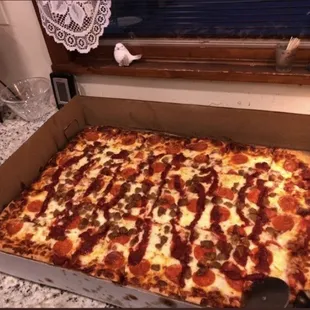 Jumbo Pizza with pepperoni, sausage and extra sauce on top