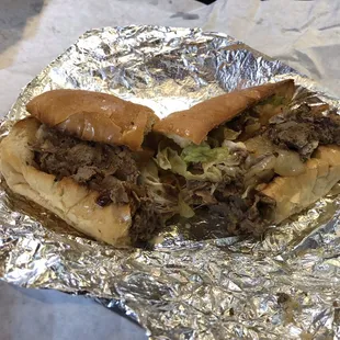 Cheesesteak with lettuce, tomato &amp; onions. Yum!