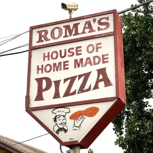 a sign for a house of home made pizza