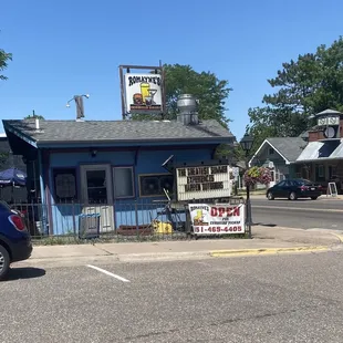 a car parked in front of a restaurant